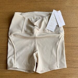 L*SPACE Cream Revel Ribbed High-Waist Bike Shorts in color bone